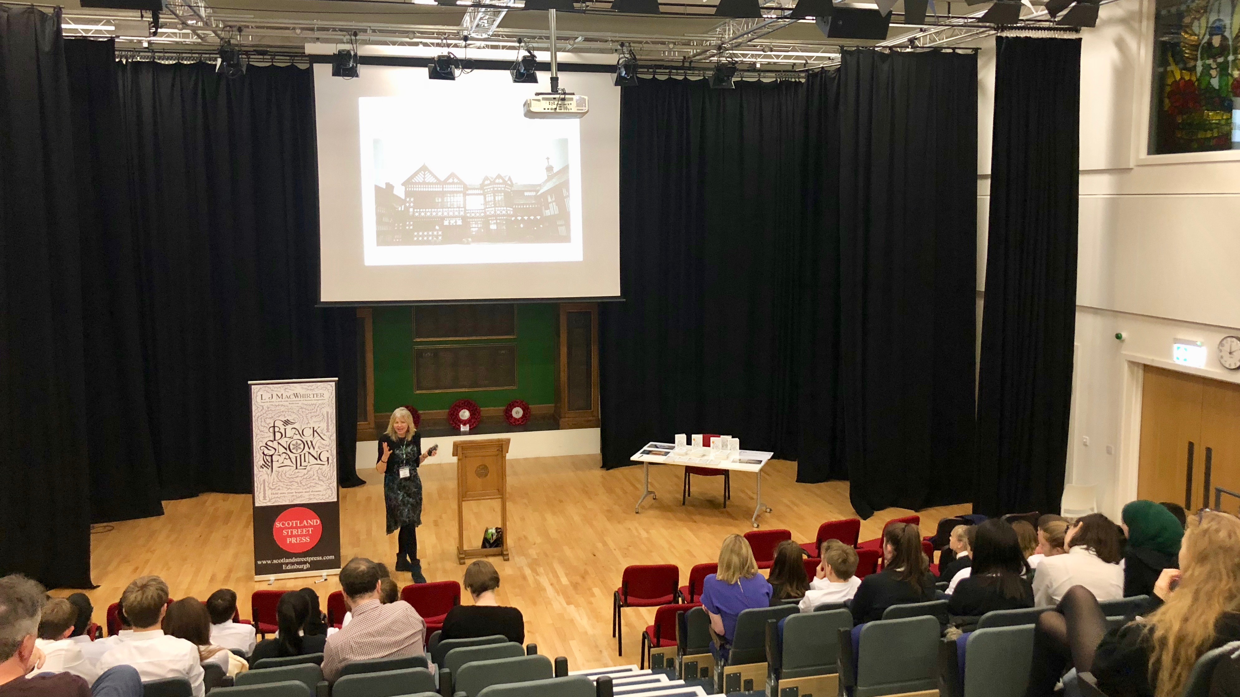 Author L.J. MacWhirter speaking at an author event
