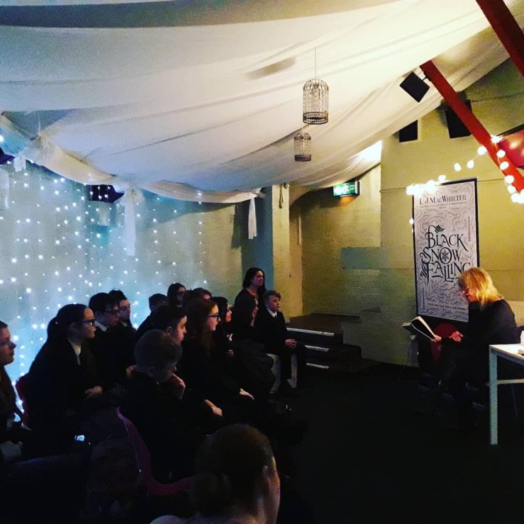 Author L.J. MacWhirter speaking at a book festival